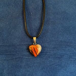 Black, burgundy, cream, brown hart pendant‎ necklace.